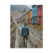 Lone Cowboy Walking Through a Rainy Frontier Street Wall Art & Canvas Print