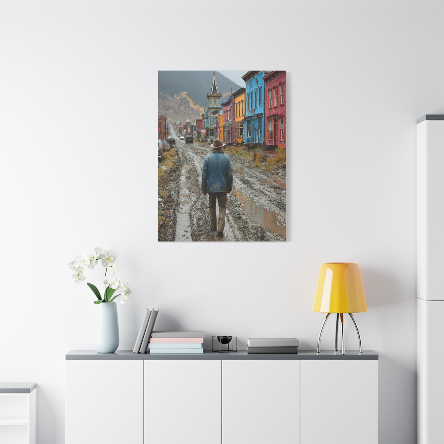 Lone Cowboy Walking Through a Rainy Frontier Street Wall Art & Canvas Print